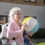 Woman playing with beach ball